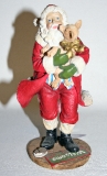 Santa holding dog tablepiece 19.5 cm