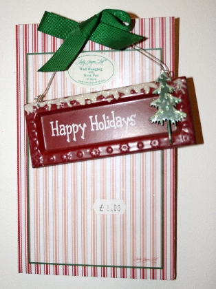 happy-holidays-sign-with-pad