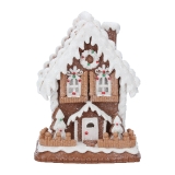 White iced gingerbread house with lights